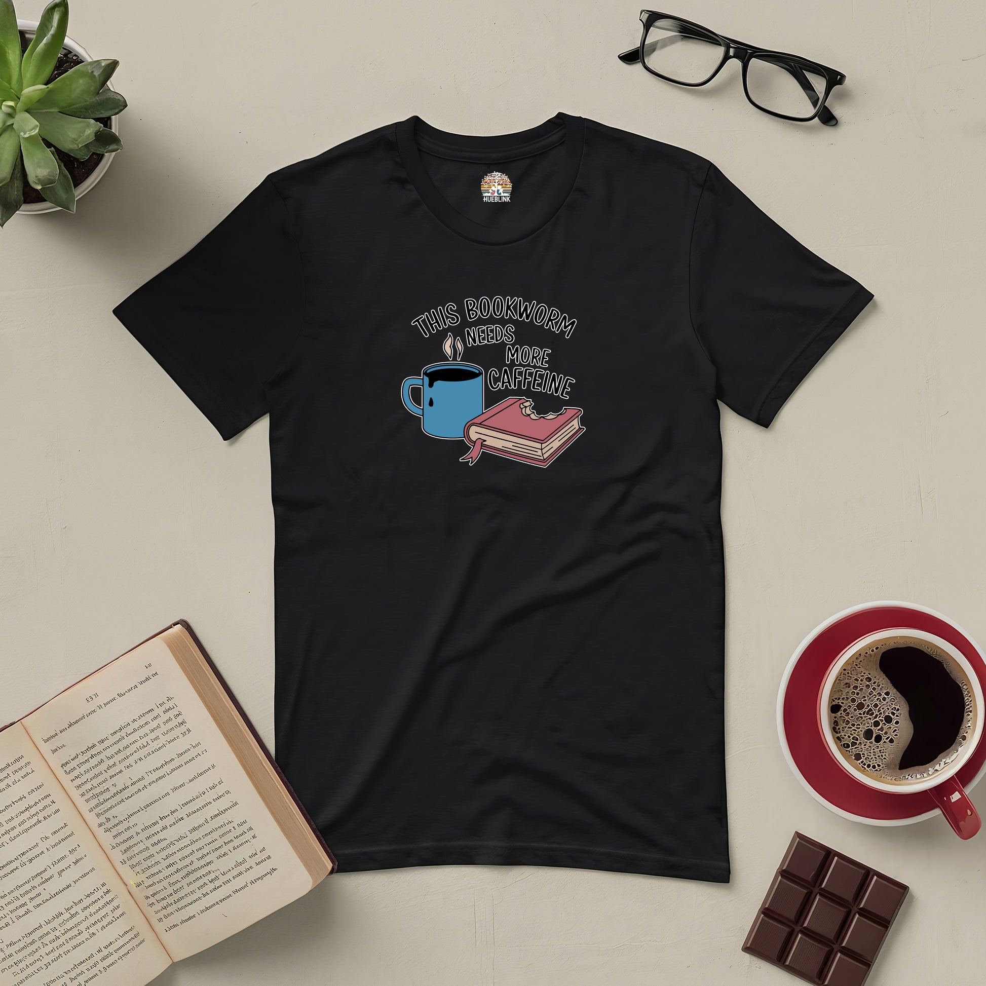 "This Bookworm Needs More Caffeine Tee with coffee and book design, perfect for readers who love caffeine-fueled reading sessions."