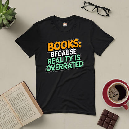 Black t-shirt with "Books: Because Reality Is Overrated" text, surrounded by glasses, coffee, chocolate, plant, and open book.