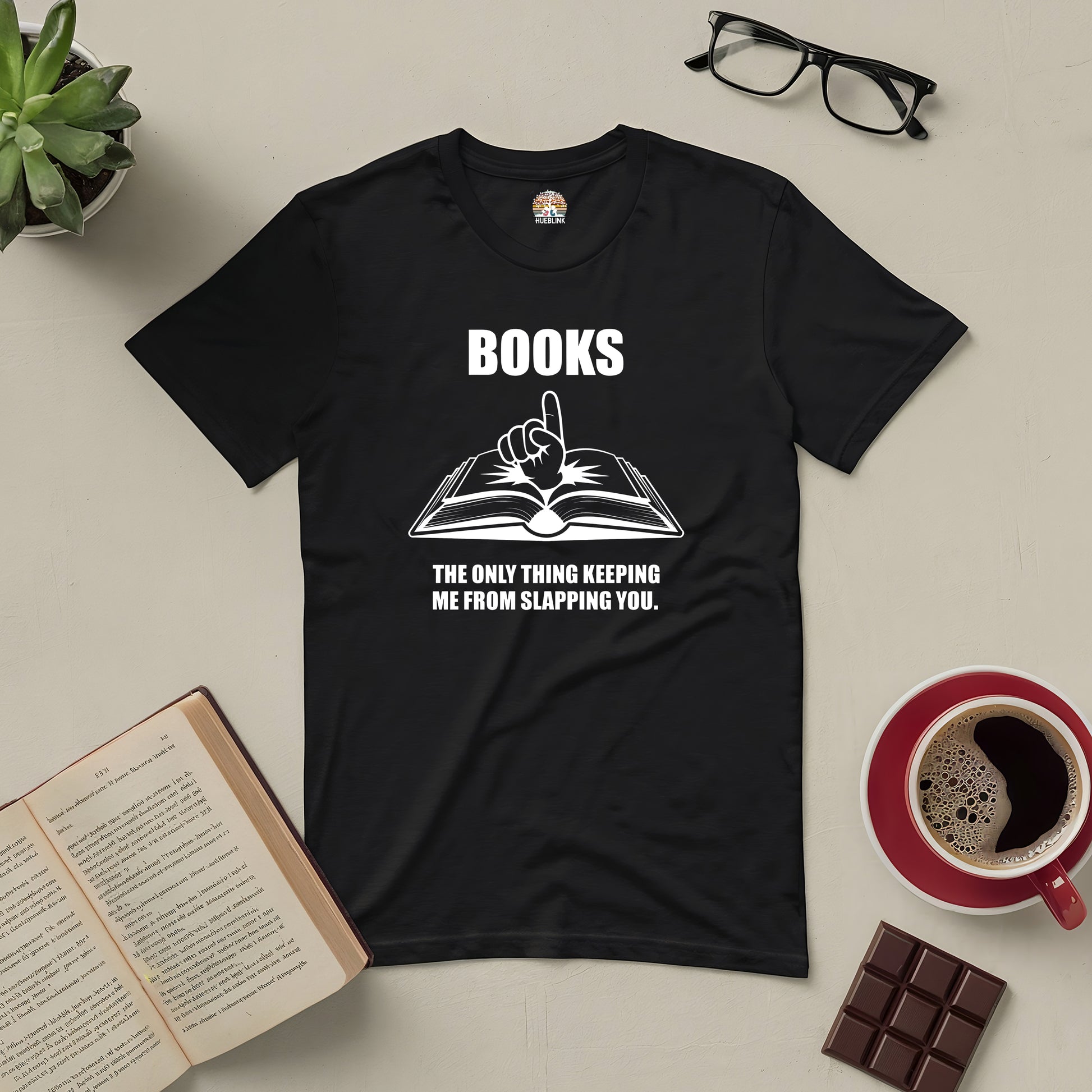 Black t-shirt featuring phrase "Books: The Only Thing Keeping Me from Slapping You" with open book graphic; humor for book lovers.