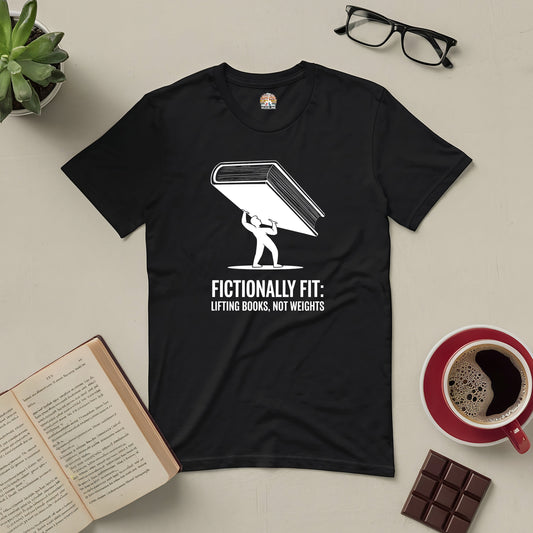 "Fictionally Fit: Lifting Books, Not Weights Tee with book graphic, surrounded by reading glasses, open book, coffee, and chocolate"