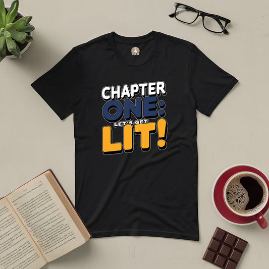 Black tee with "Chapter One: Let’s Get Lit!" text, surrounded by books, coffee, and chocolate, perfect for book lovers and party enthusiasts.