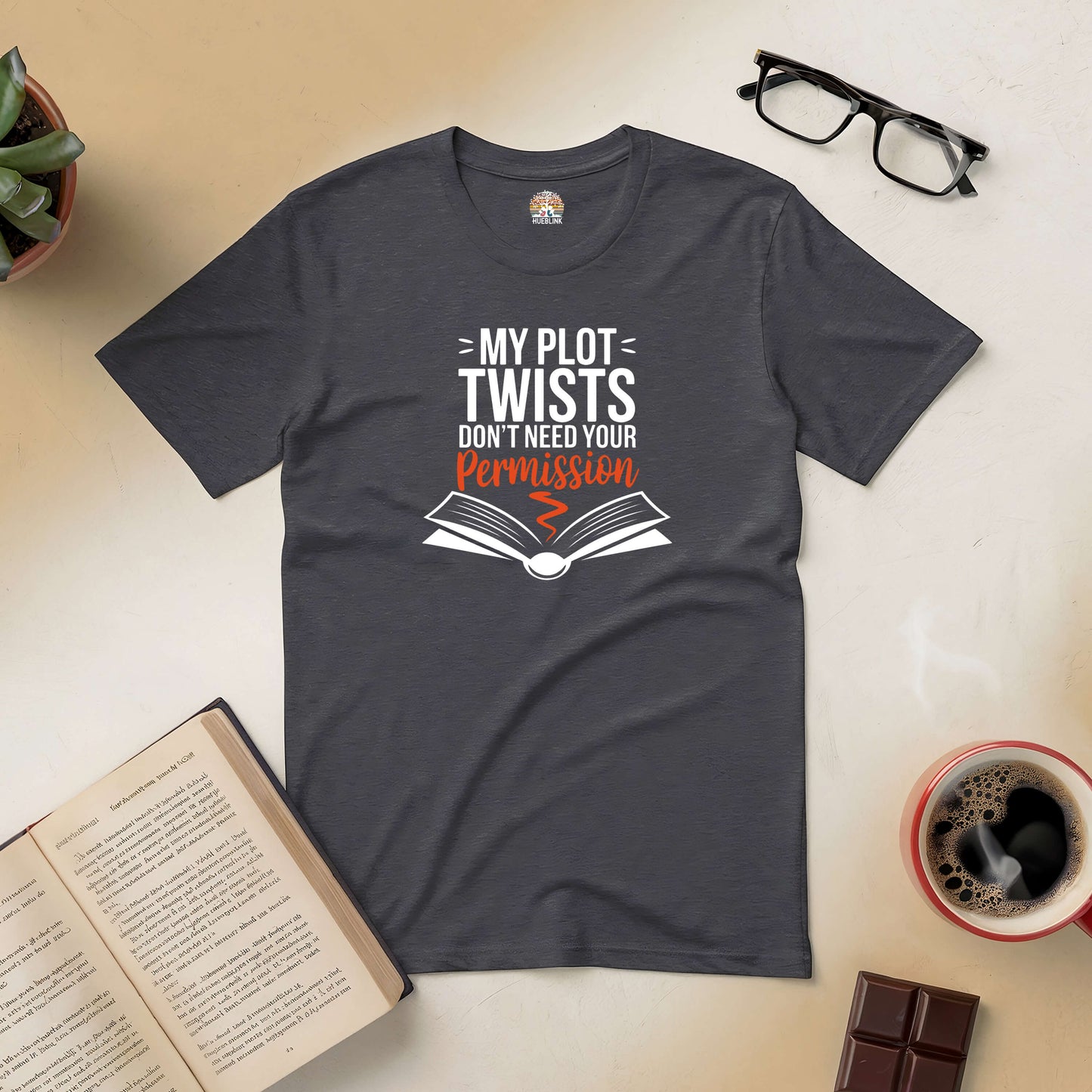 "Unisex gray t-shirt with bold 'My Plot Twists Don't Need Your Permission' text, styled for independent storytellers."