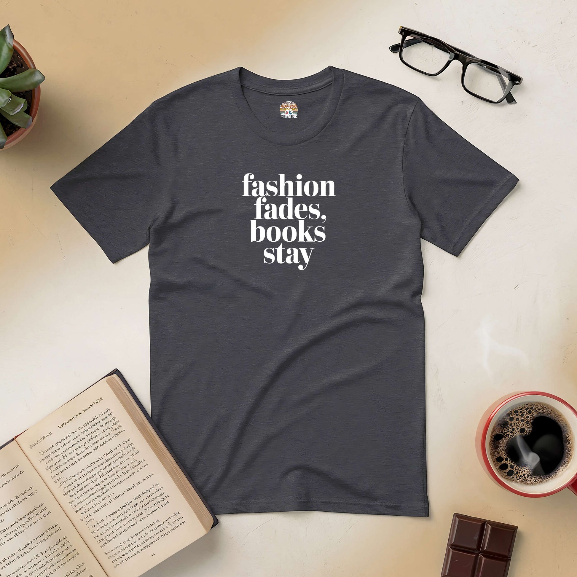 Minimalist "Fashion Fades, Books Stay" tee with books, coffee, glasses, and chocolate, celebrating timeless literature style.