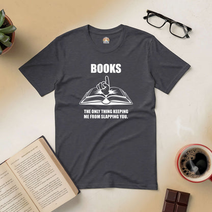 Black "Books: The Only Thing Keeping Me from Slapping You" tee with open book graphic, surrounded by coffee, glasses, and books.