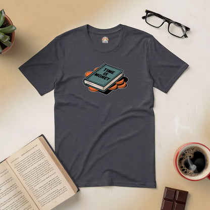 "Time Is Money tee in charcoal with graphic design, surrounded by glasses, coffee, book, plant, and chocolate"