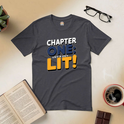 Chapter One: Let’s Get Lit! Tee displayed with books, coffee, and glasses, perfect for fun-loving book enthusiasts.