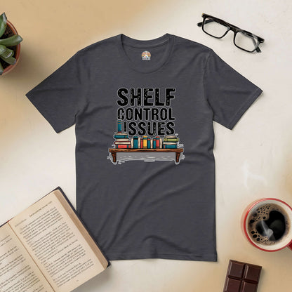 "Shelf Control Issues tee with book graphic, surrounded by open book, glasses, and coffee - perfect for book lovers"