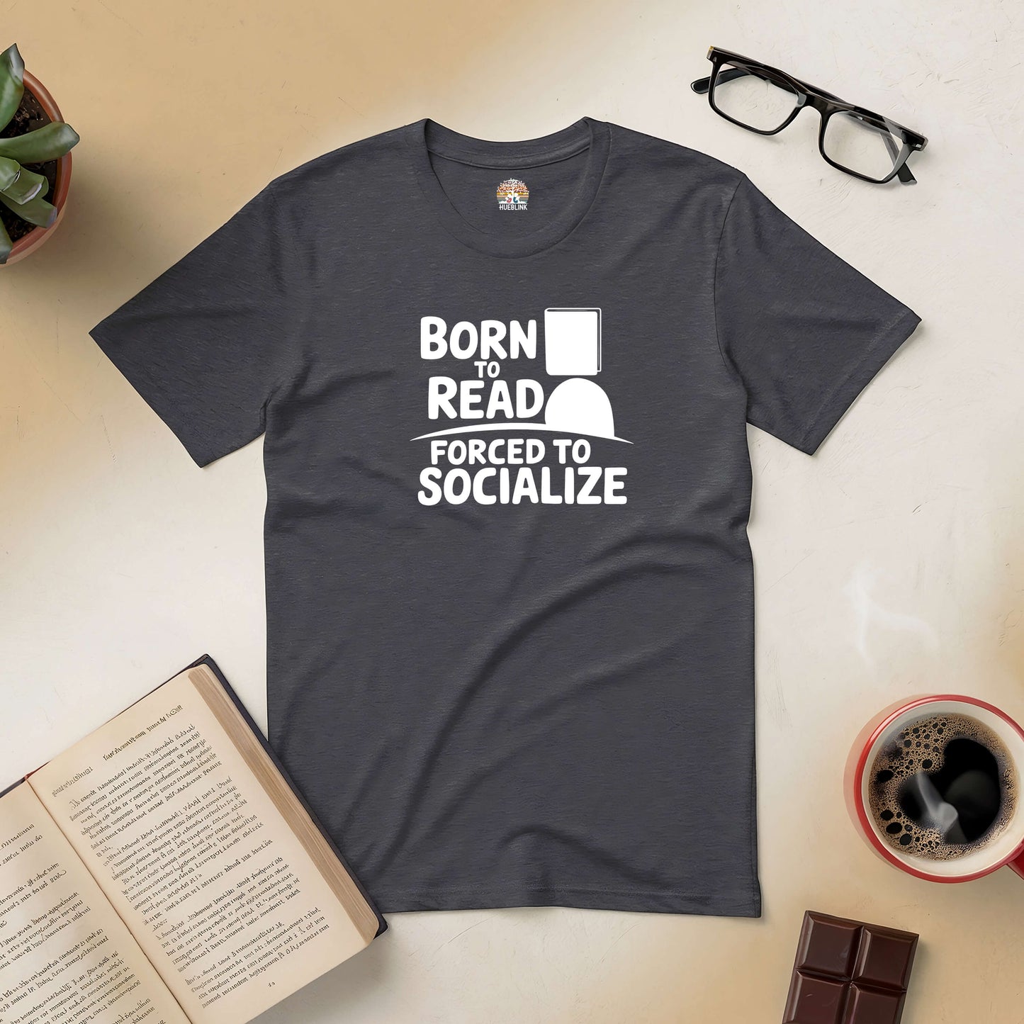 "Born to Read, Forced to Socialize Tee for introverts with book, coffee, and glasses setup"