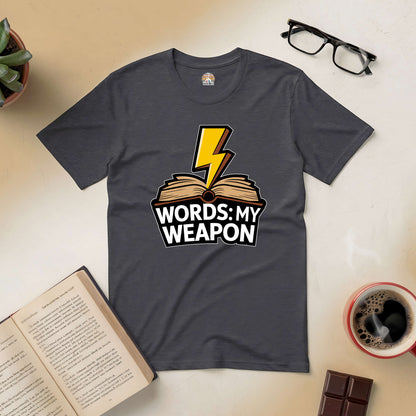 "Words: My Weapon Tee with book and lightning bolt design, symbolizing the power of language over fists."