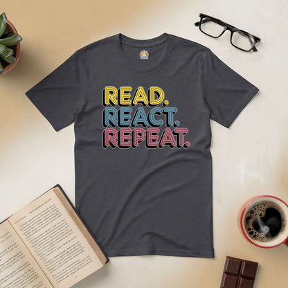 "Read. React. Repeat. Tee with colorful text, perfect for book lovers, surrounded by an open book, coffee, and glasses."