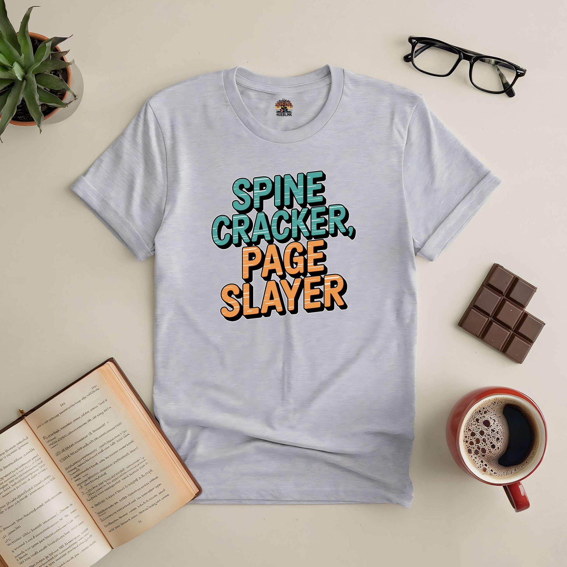 "Spine Cracker Page Slayer Tee for book lovers with open book, coffee, chocolate, and glasses"