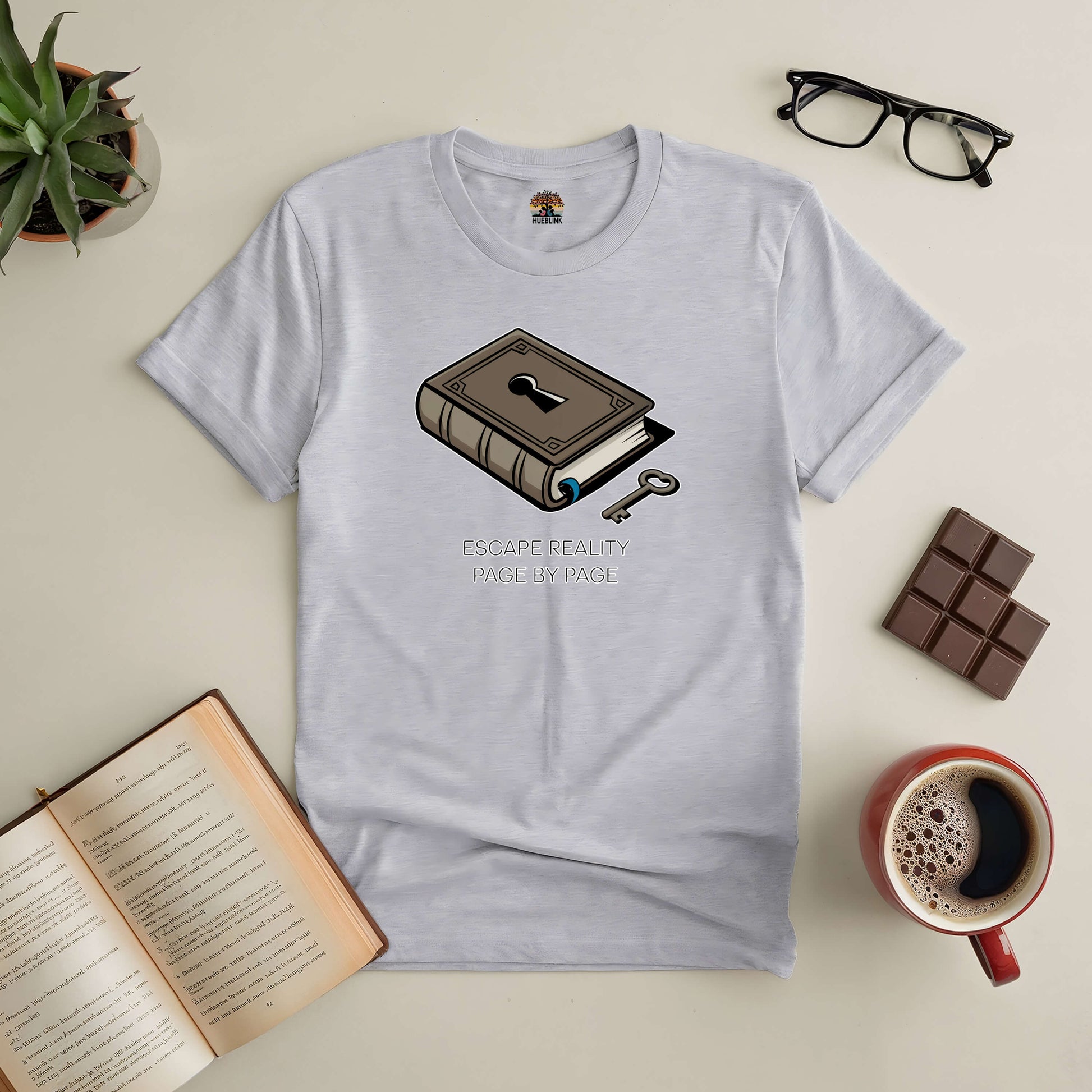 Escape Reality Page by Page tee with book and key design, perfect for book lovers seeking adventure.