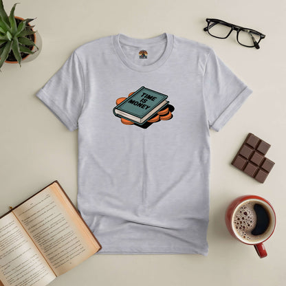 "Time Is Money Tee with clock and book graphic, ideal for go-getters valuing every second, styled with coffee and books"