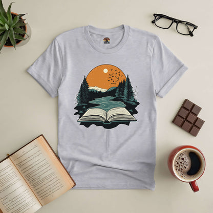 White tee with "Absorbed in Nature" design featuring an open book, mountains, and sunset. Perfect for book and nature lovers.