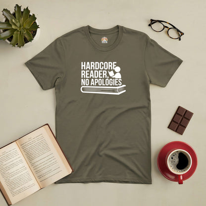 Olive green t-shirt with "Hardcore Reader, No Apologies" design, surrounded by a book, glasses, chocolate, and a coffee cup.