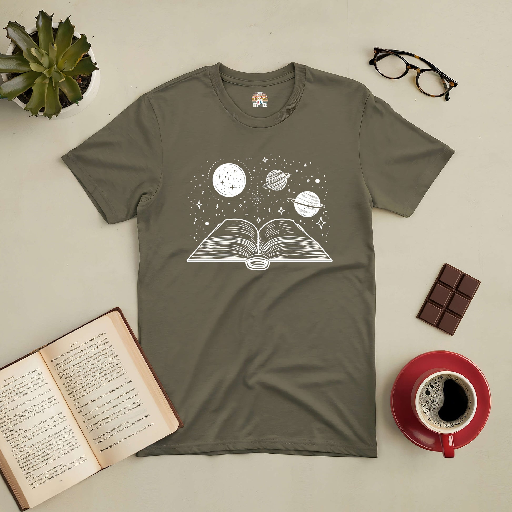 Journey Through Space Tee featuring galaxy and open book design, ideal for book lovers and space enthusiasts.