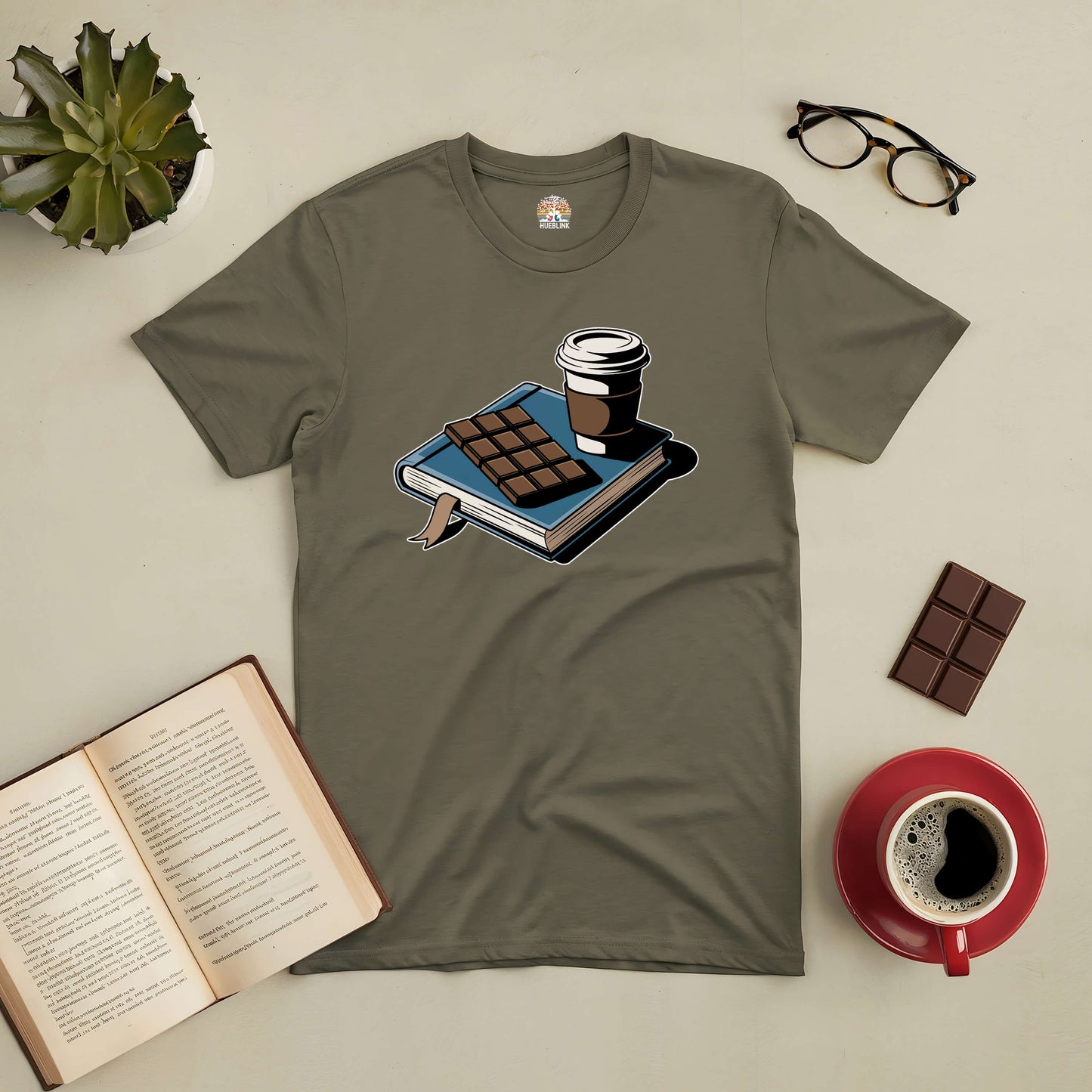 Cozy tee with a design of a book, coffee, and chocolate, perfect for sweet reading moments.