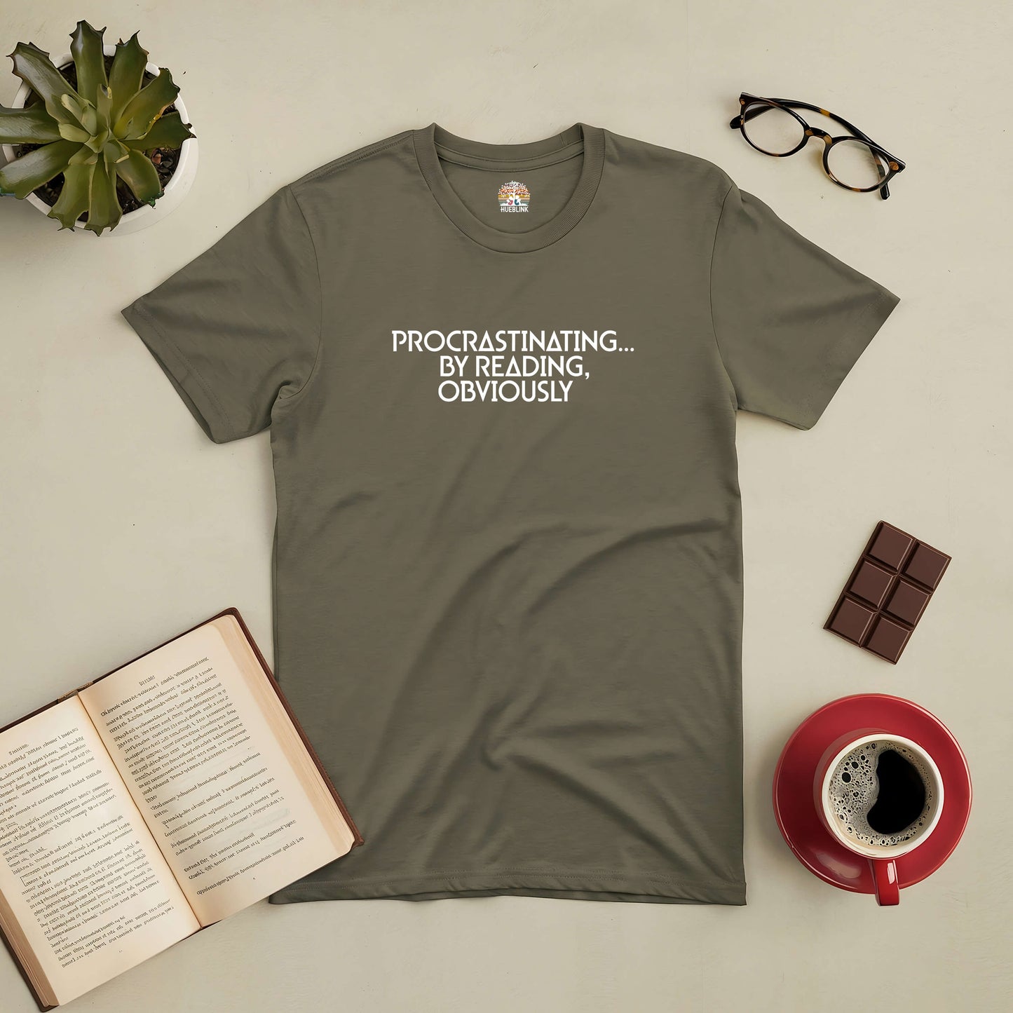 "Procrastinating by Reading Obviously Tee with books, coffee, and chocolate flat lay"