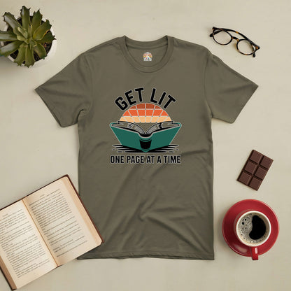 Olive green "Get Lit: One Page At A Time" t-shirt featuring an open book design, surrounded by coffee, glasses, and chocolate.