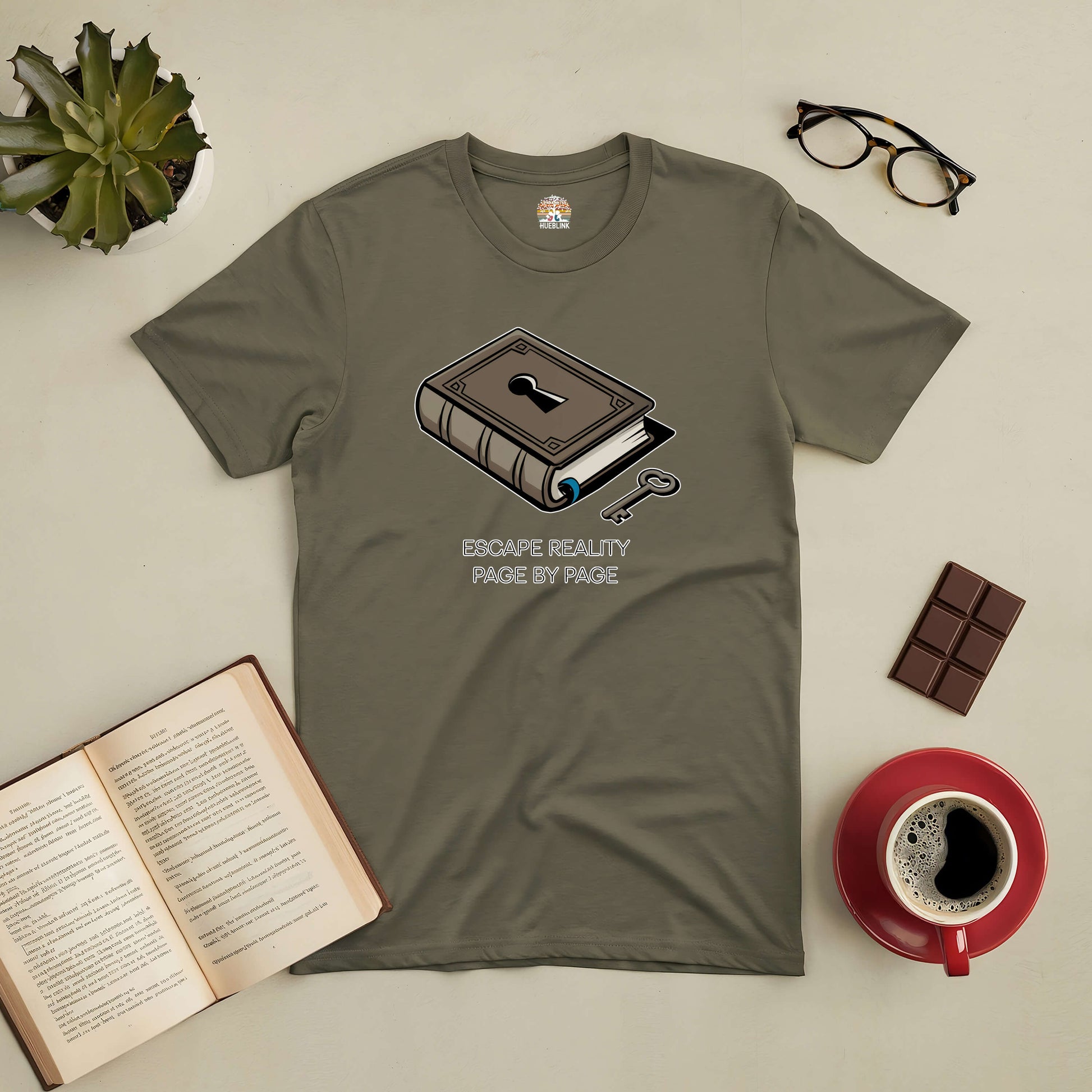 "Escape Reality Page by Page tee for book lovers with book graphic, coffee, chocolate, and open book on table"