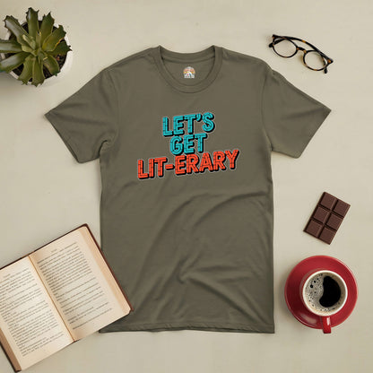 "Let's Get Lit-erary Tee with colorful text displayed beside a book, coffee, and glasses on a cozy setting"