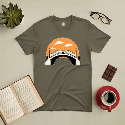 "Connection Through Decades Tee with book and bridge design on taupe background, symbolizing the bridge literature builds through time"