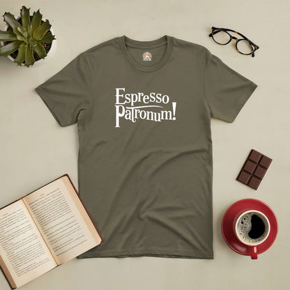 "Espresso Patronum tee displayed with coffee, book, chocolate, glasses, and plant on a table"