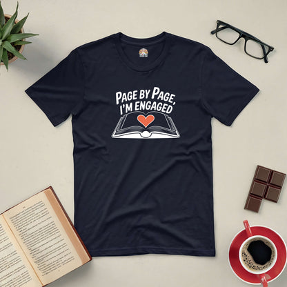 "Page by Page, I’m Engaged Tee for passionate book lovers, featuring an open book design with a heart on a dark background"