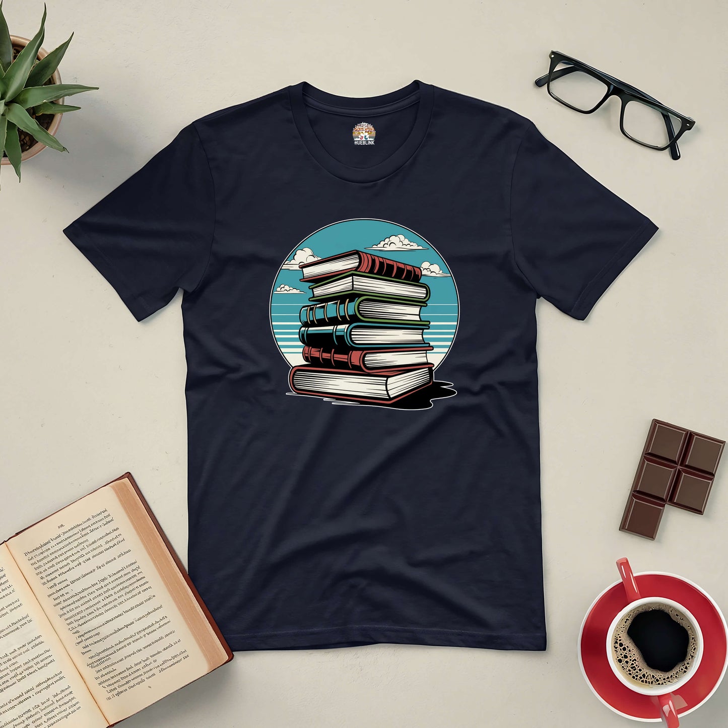 Silent Knowledge Tee featuring a serene stack of books against an open sky, ideal for introspective readers seeking timeless wisdom.