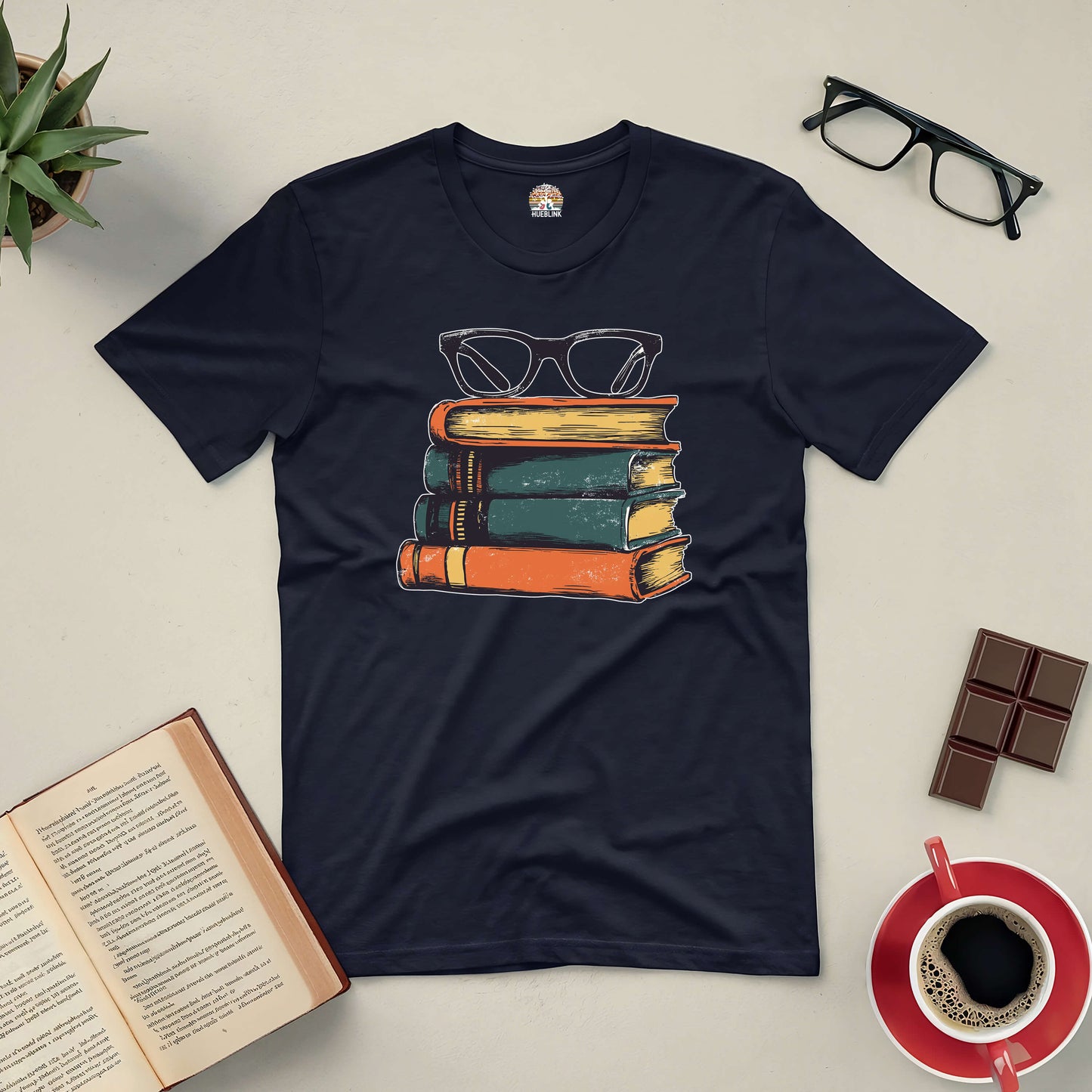 "Seeing Even More Tee with vintage books and glasses design, perfect for fashion-savvy readers, surrounded by coffee and open book"