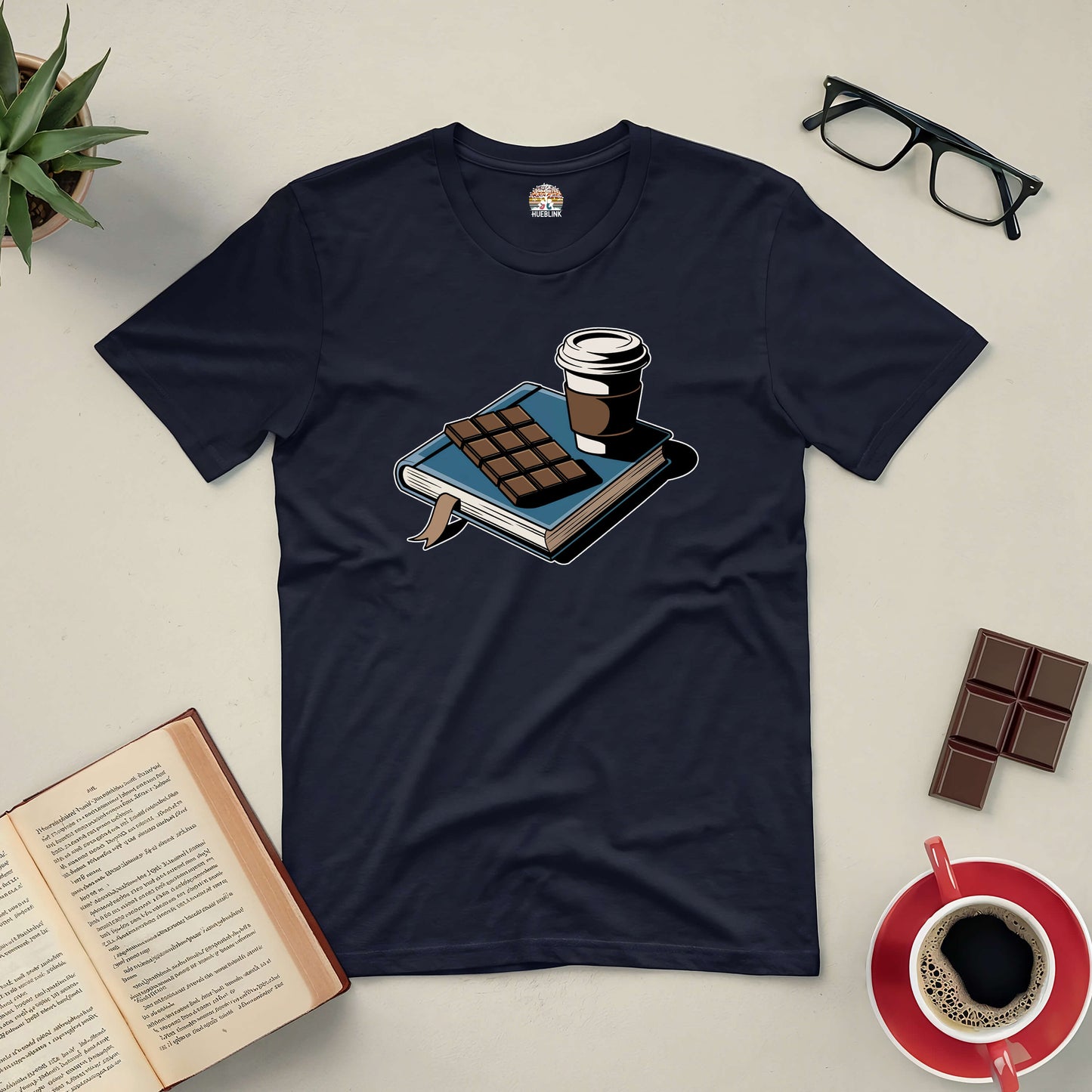 "Sweet Moments with a Good Book Tee featuring a cozy design with a book, coffee, and chocolate."