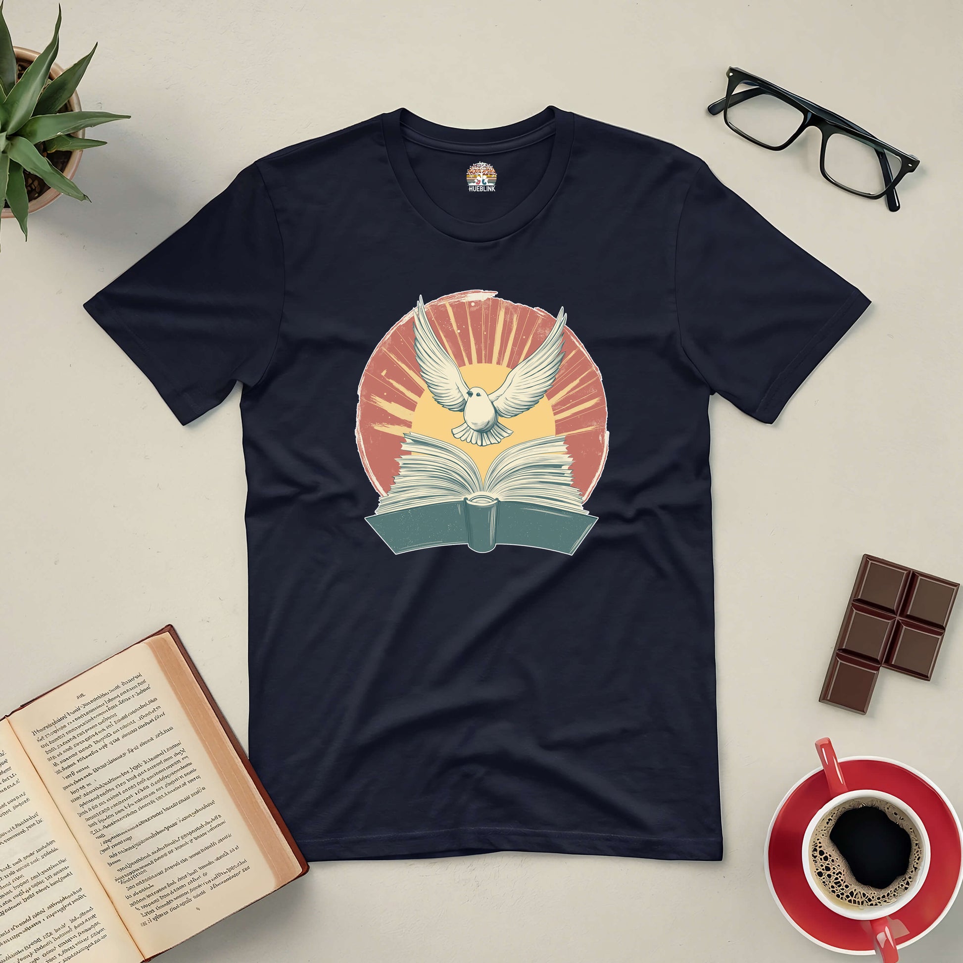 "Boundless Horizons Tee featuring open book and soaring bird design, symbolizing limitless imagination and freedom in reading"