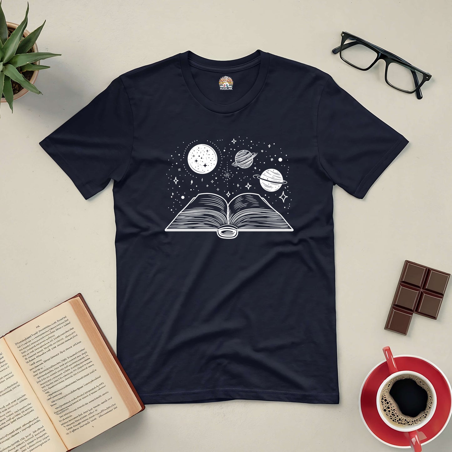 "Journey Through Space Tee featuring book with planets design, perfect for book lovers and space enthusiasts."