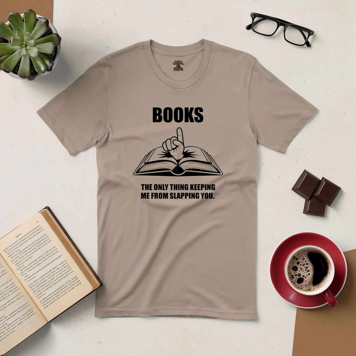 Beige t-shirt with the text "Books: The Only Thing Keeping Me from Slapping You," humorously conveying a book lover's attitude.