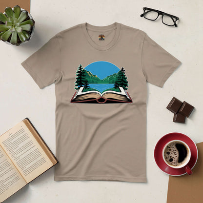 "Book Your Escape Tee with nature and book design, perfect for wanderlust souls and book lovers, surrounded by coffee and open book."