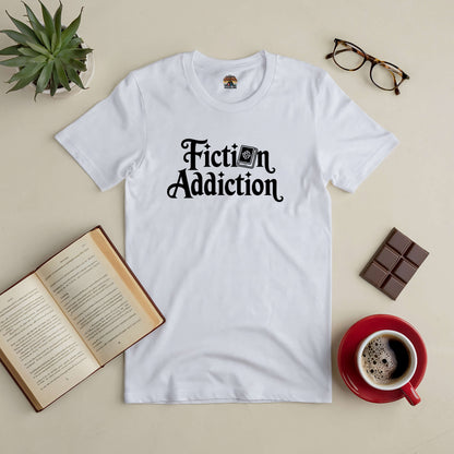 "Fiction Addiction Tee with open book, glasses, chocolate, and coffee for book lovers"