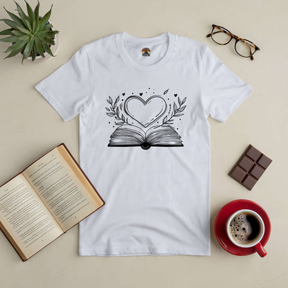 "Love Stories Tee with heart and book design, surrounded by coffee, glasses, and open book, ideal for romance enthusiasts."